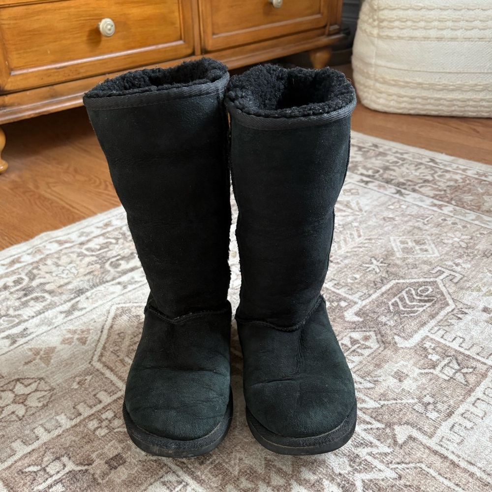 Black tall Ugg boot